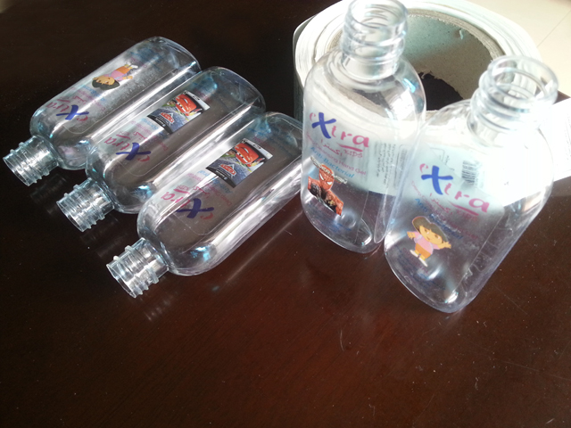 transparent labels labelled samples bottles plane surface Mrwan prøve gjennomsiktige etiketter og flasker (3).jpg