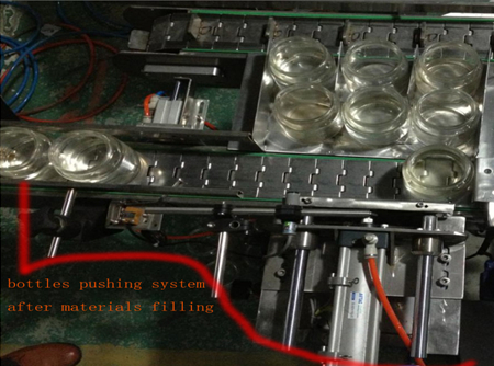 automatic bottles pushing system after filing flaskeskyvesystem.jpg